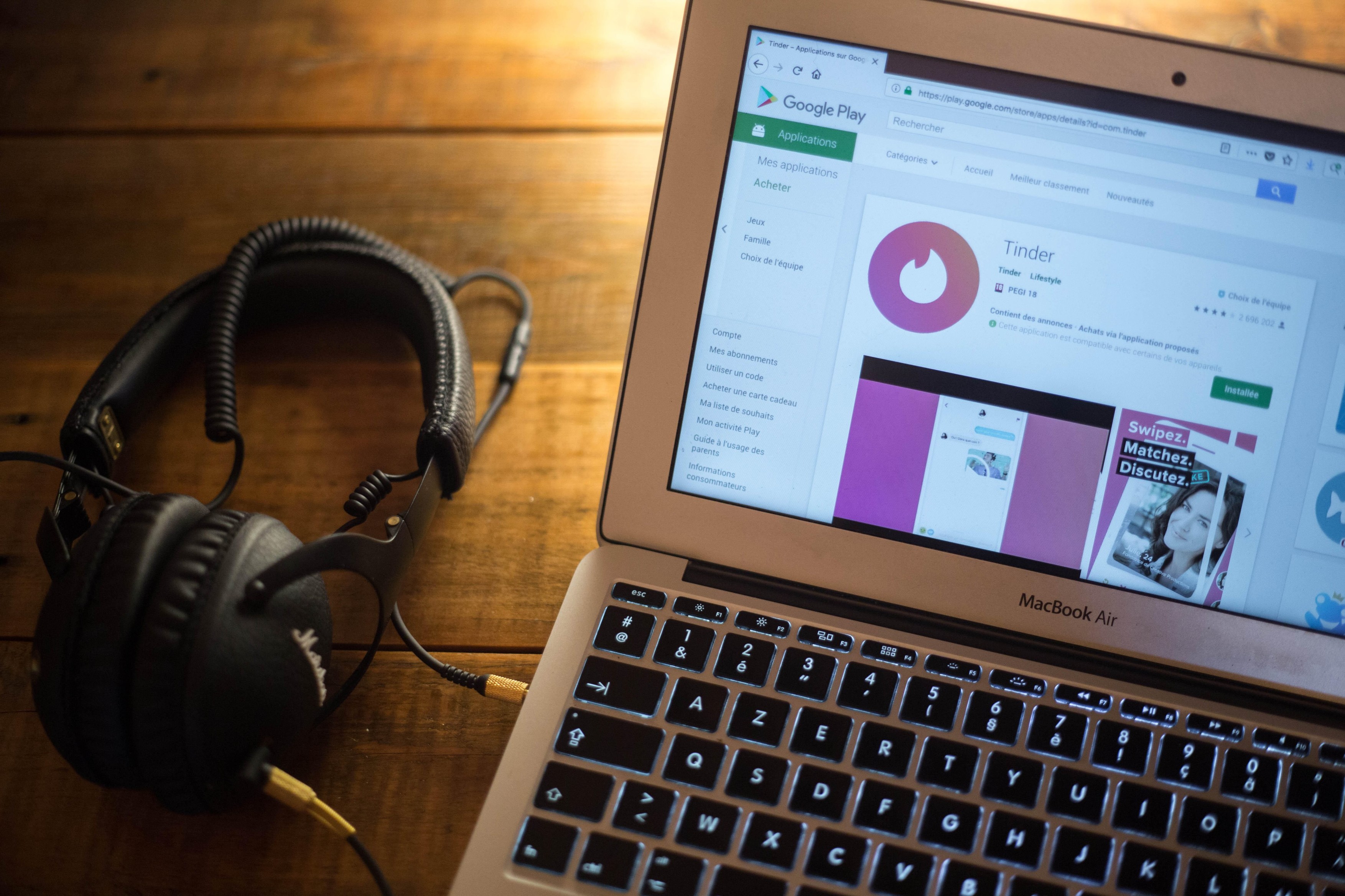 The Tinder application seen displayed on a Apple MacBook Air computer monitor via the Google Play Store.