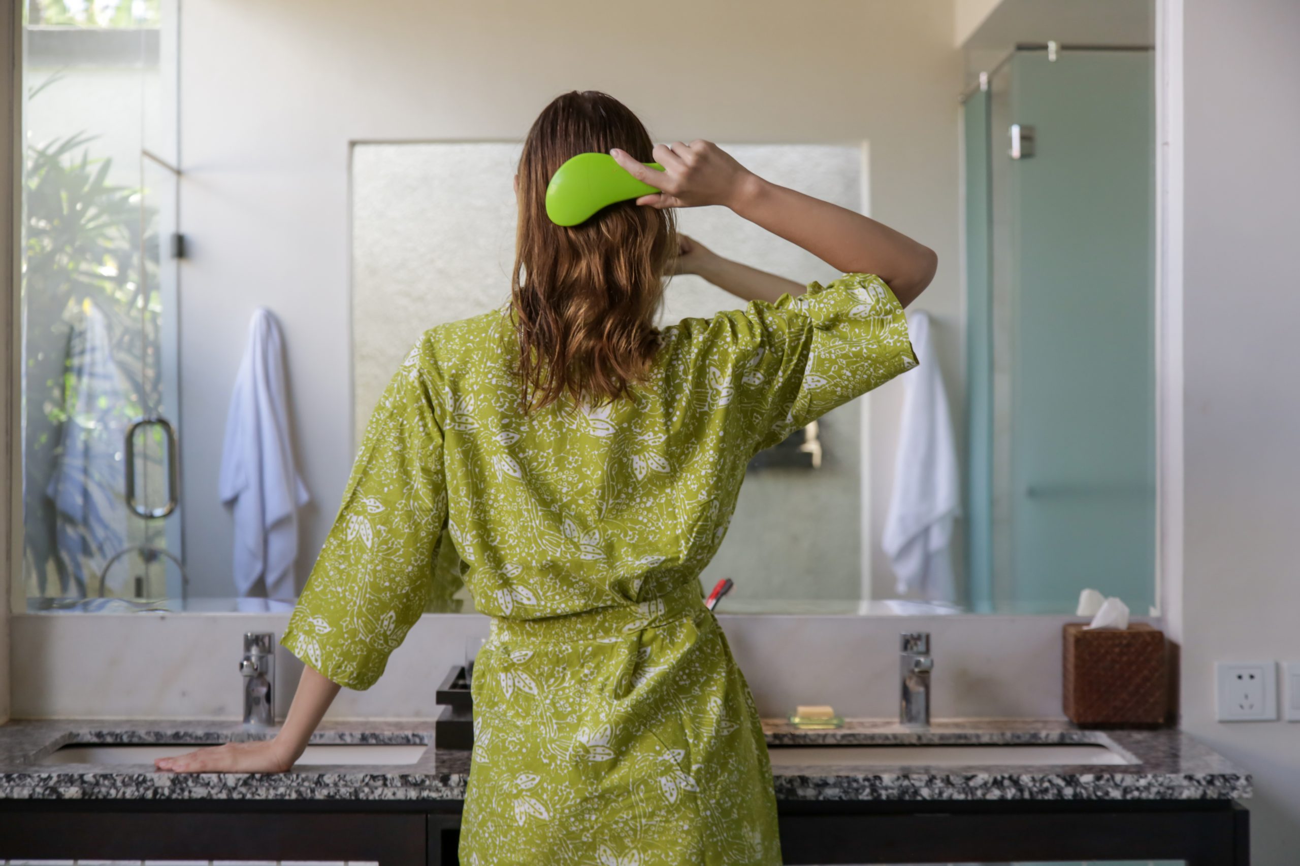 Hair,Care.,Rare,View,Of,Brunette,Woman,Combing,Hair,With