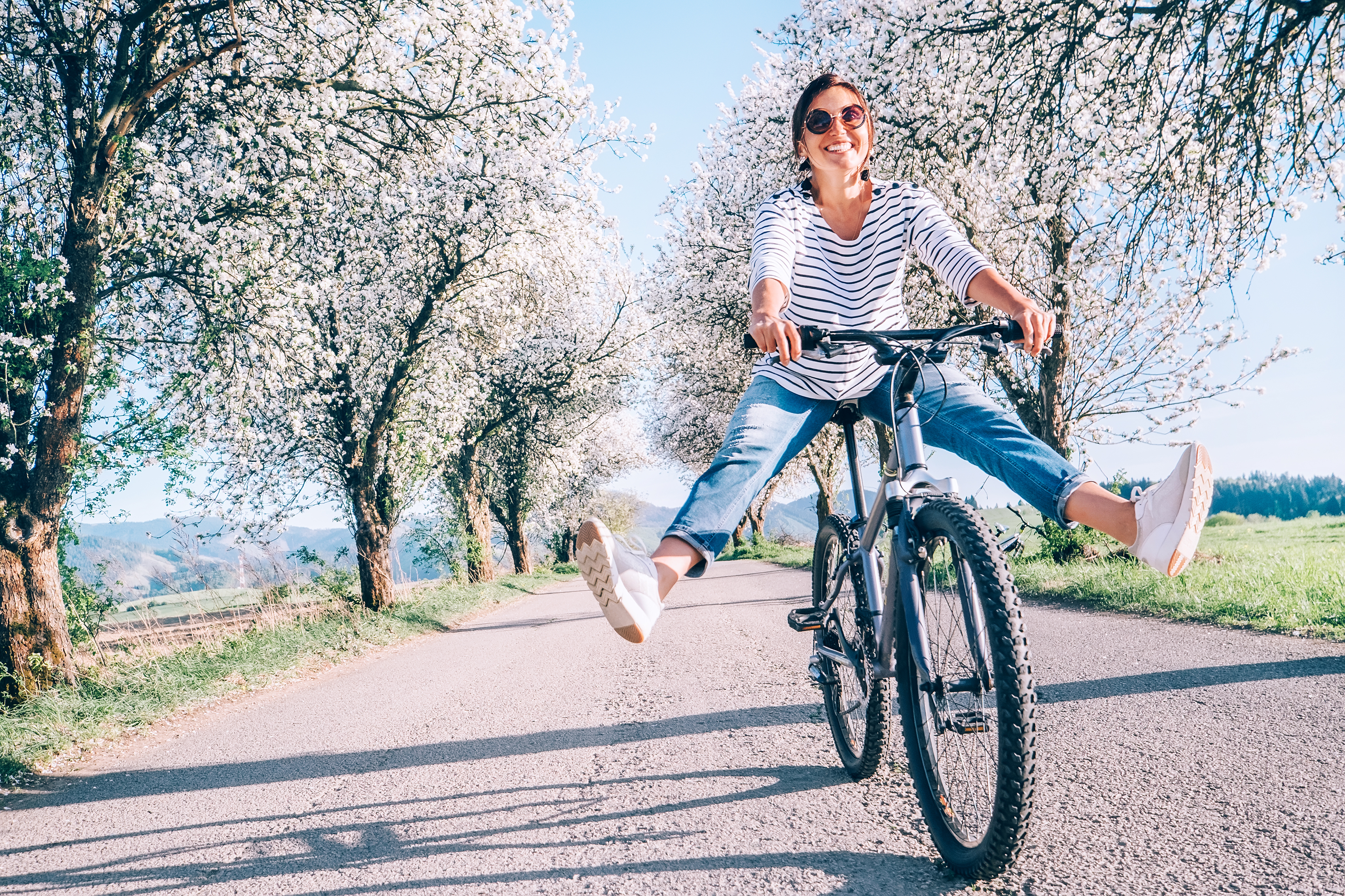 Happy,Smiling,Woman,Cheerfully,Spreads,Legs,On,Bicycle,On,The