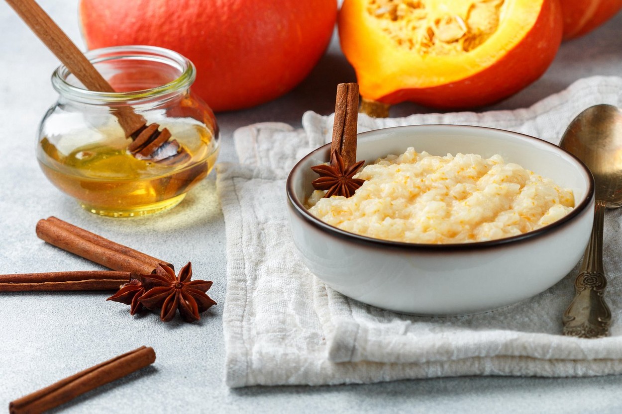 Delicious rice porridge with pumpkin, honey, cinnamon and star anise. Diet healthy Breakfast. Selective focus