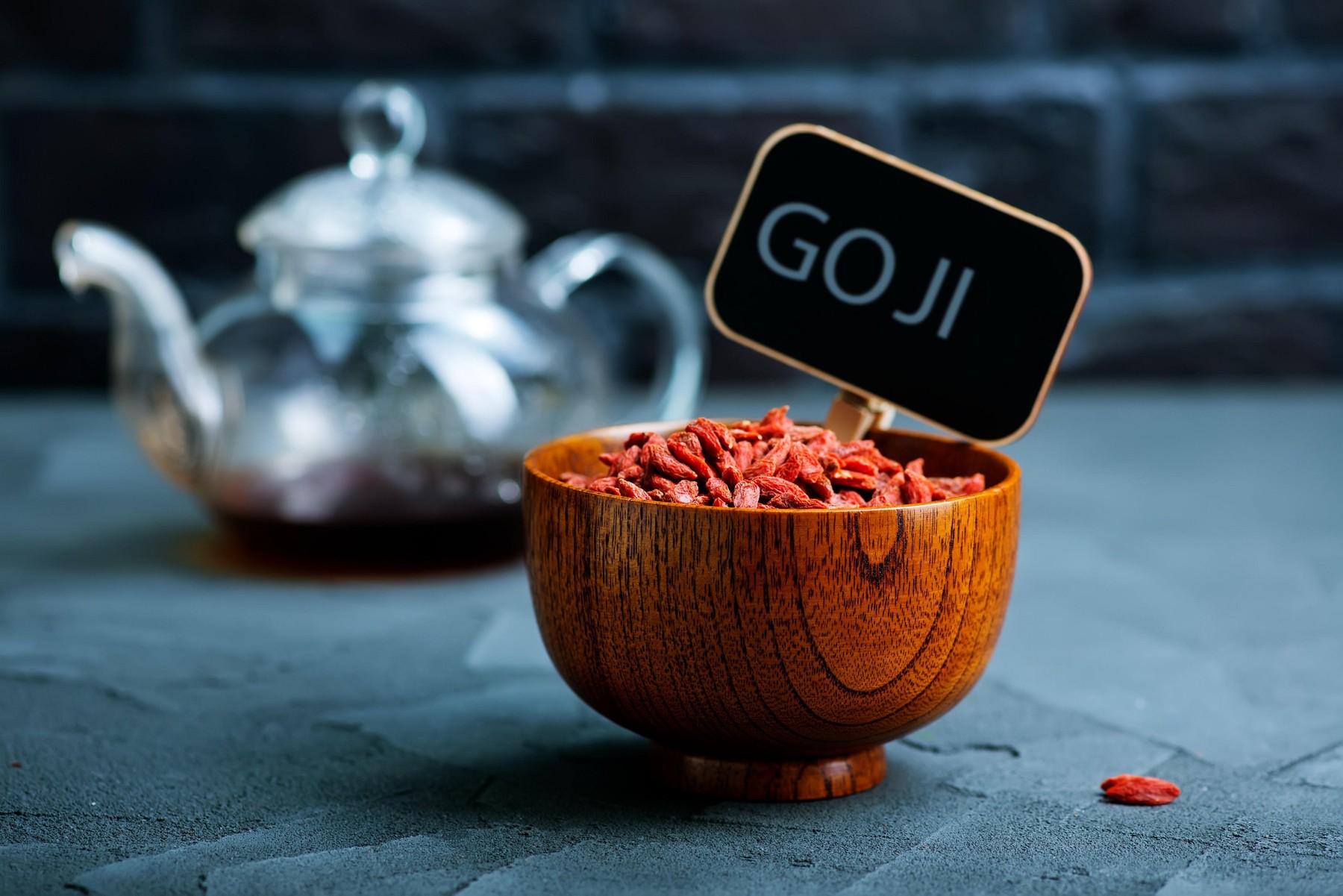 dry goji in bowl and on a table