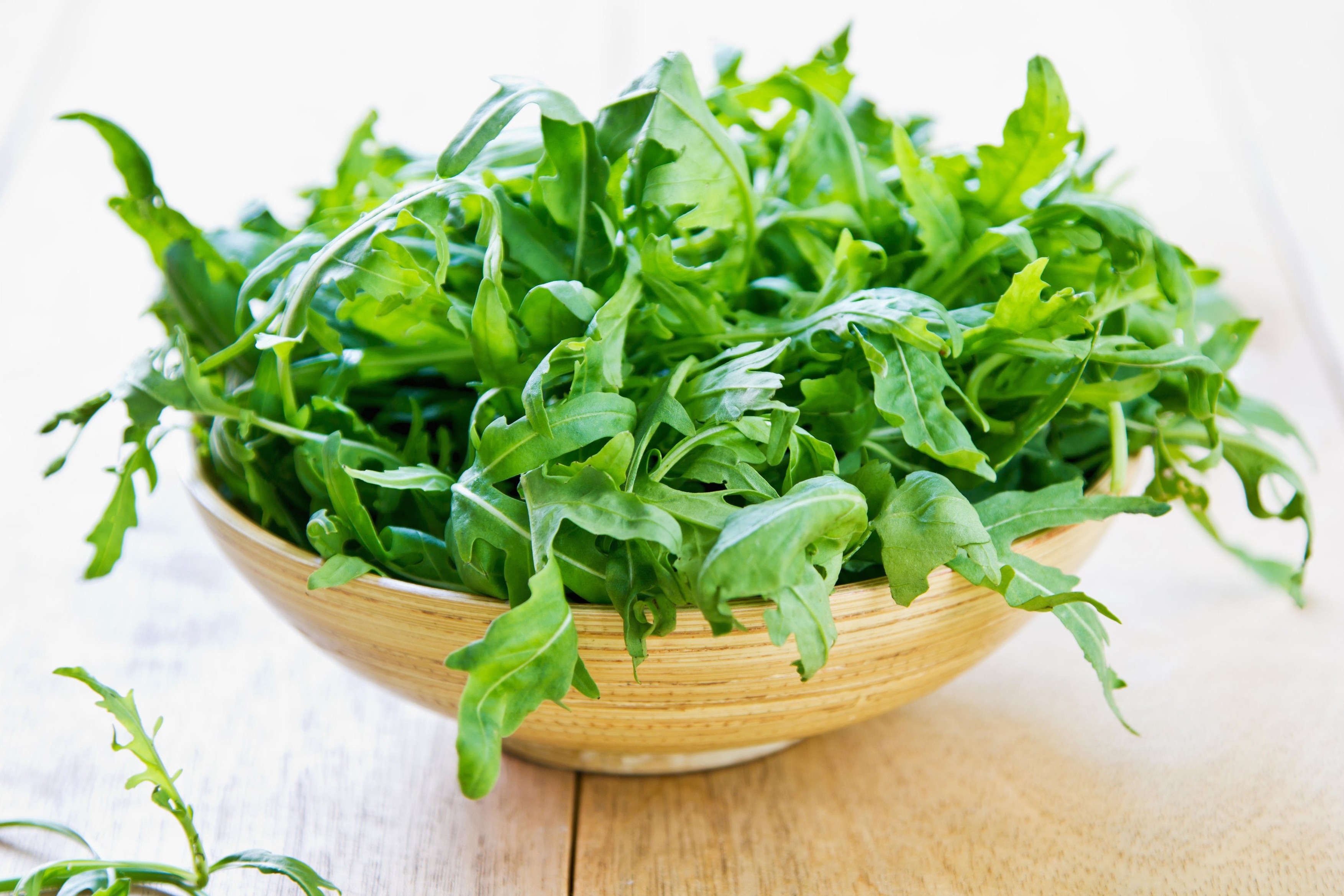 Fresh Rocket or Arugula in bamboo bowl
