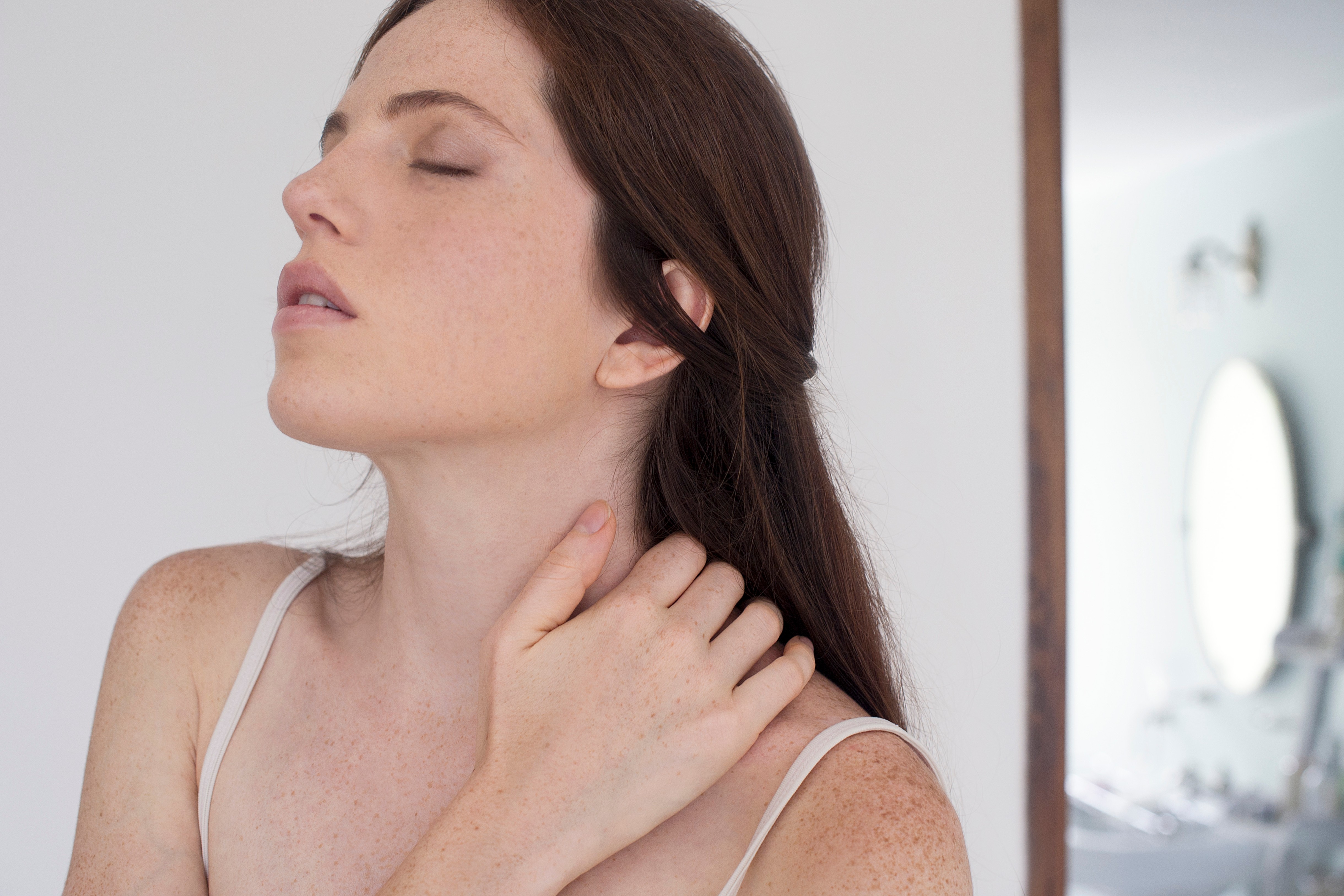 Woman massaging neck
