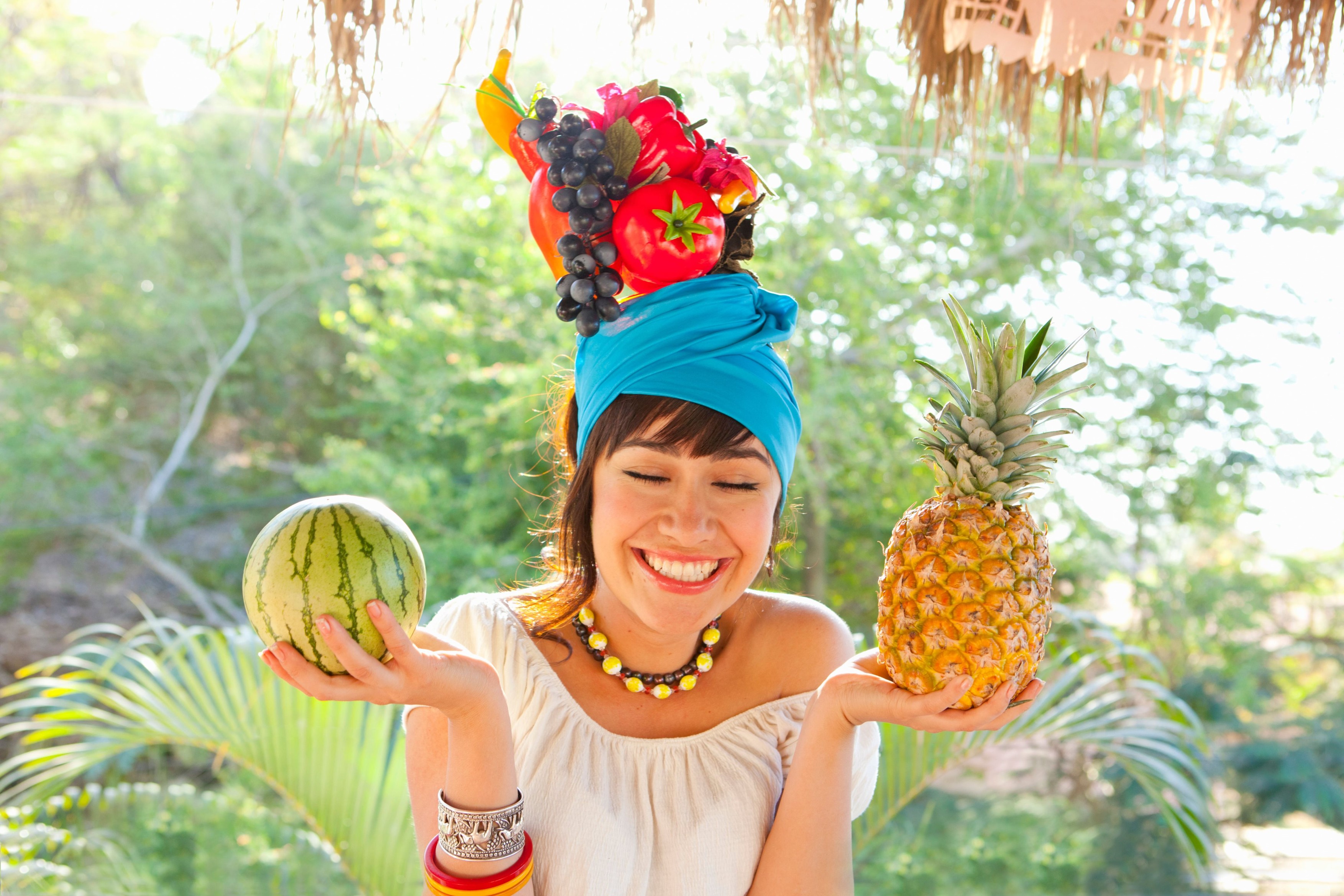 young woman wearing fruit hat