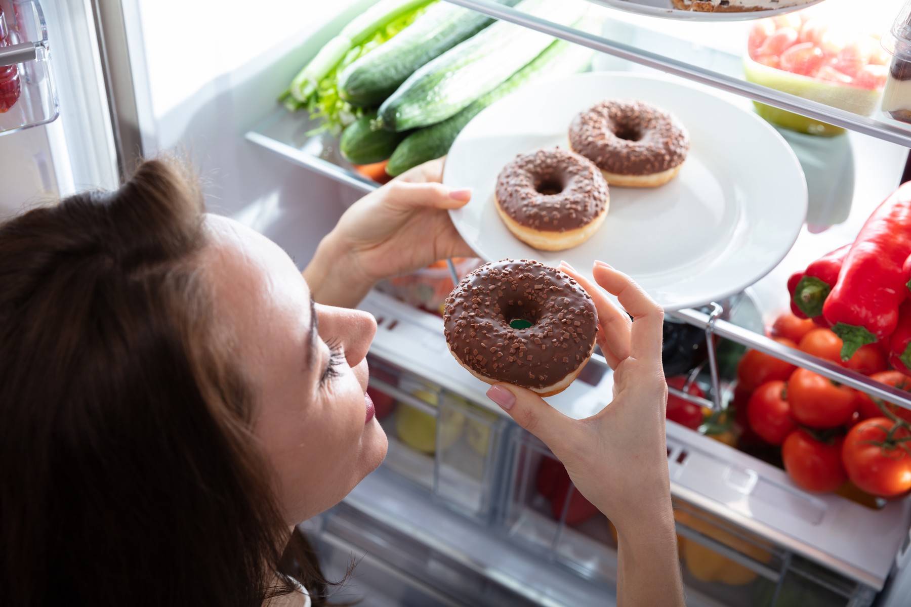 Happy Woman Taking Donut From Plate