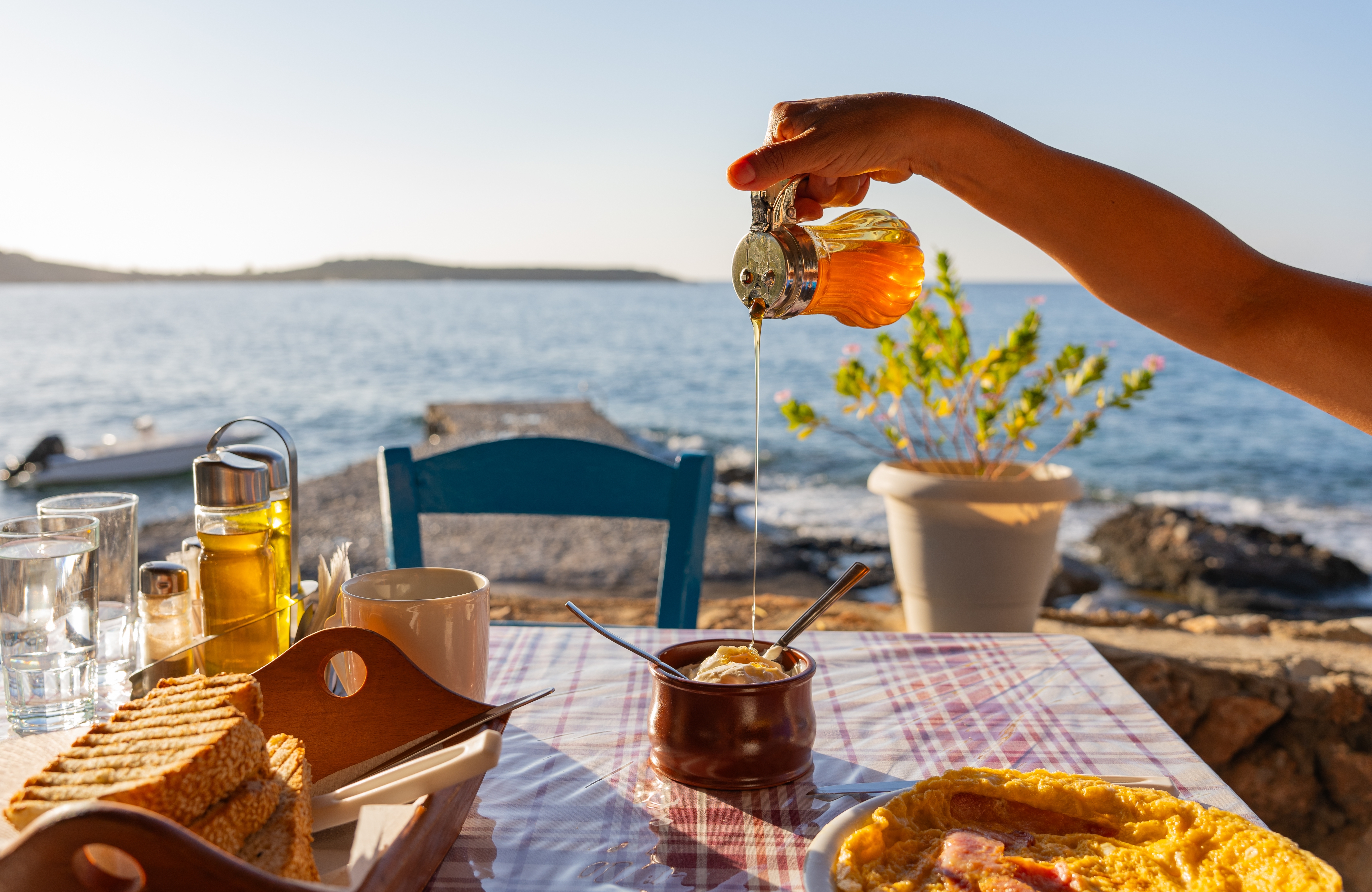Close,Up,Greek,Tavern,Table,At,Sunrise,With,A,Full