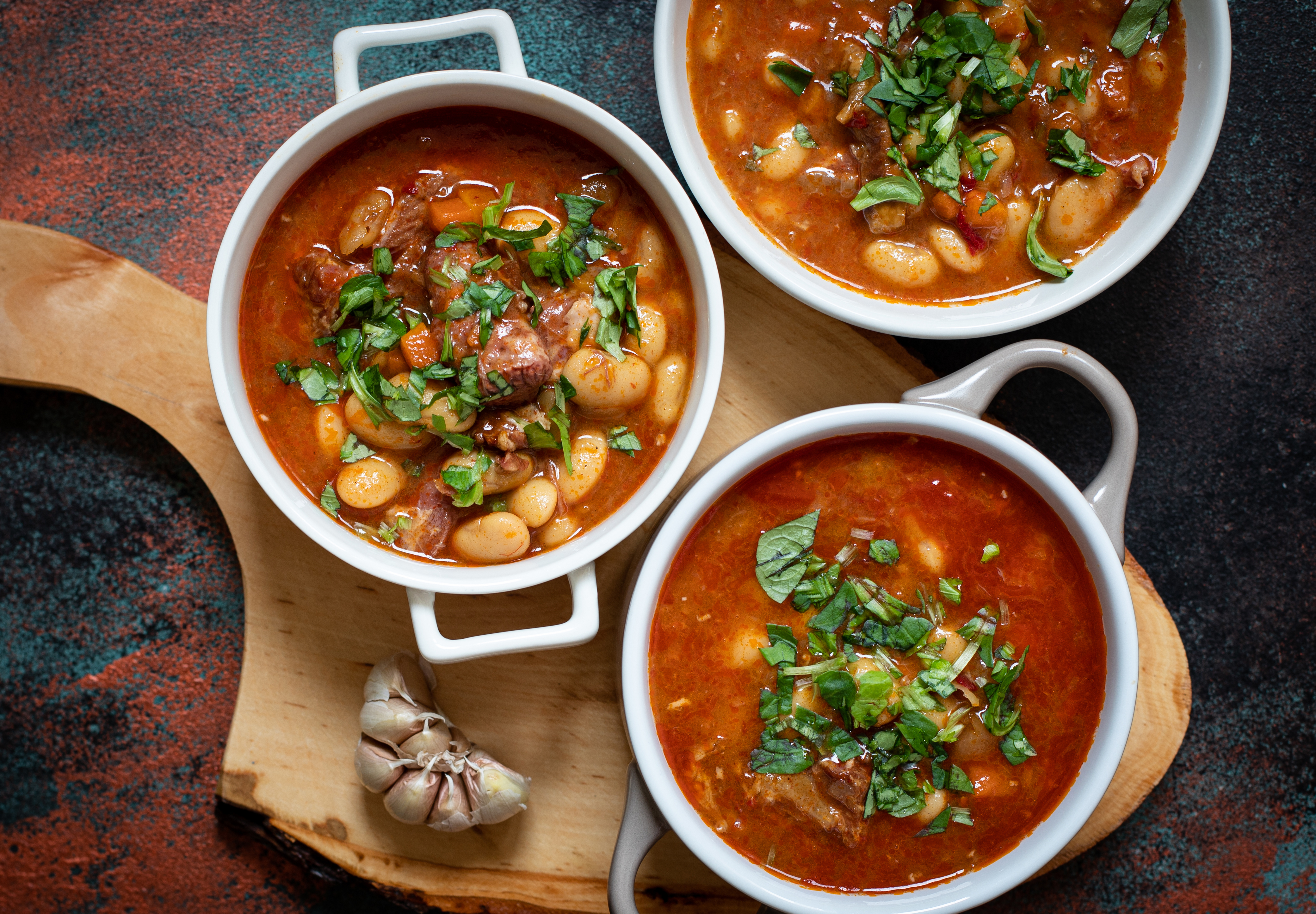 Bean,Soup,With,Meat,And,Vegetables,Served,On,A,Rustic