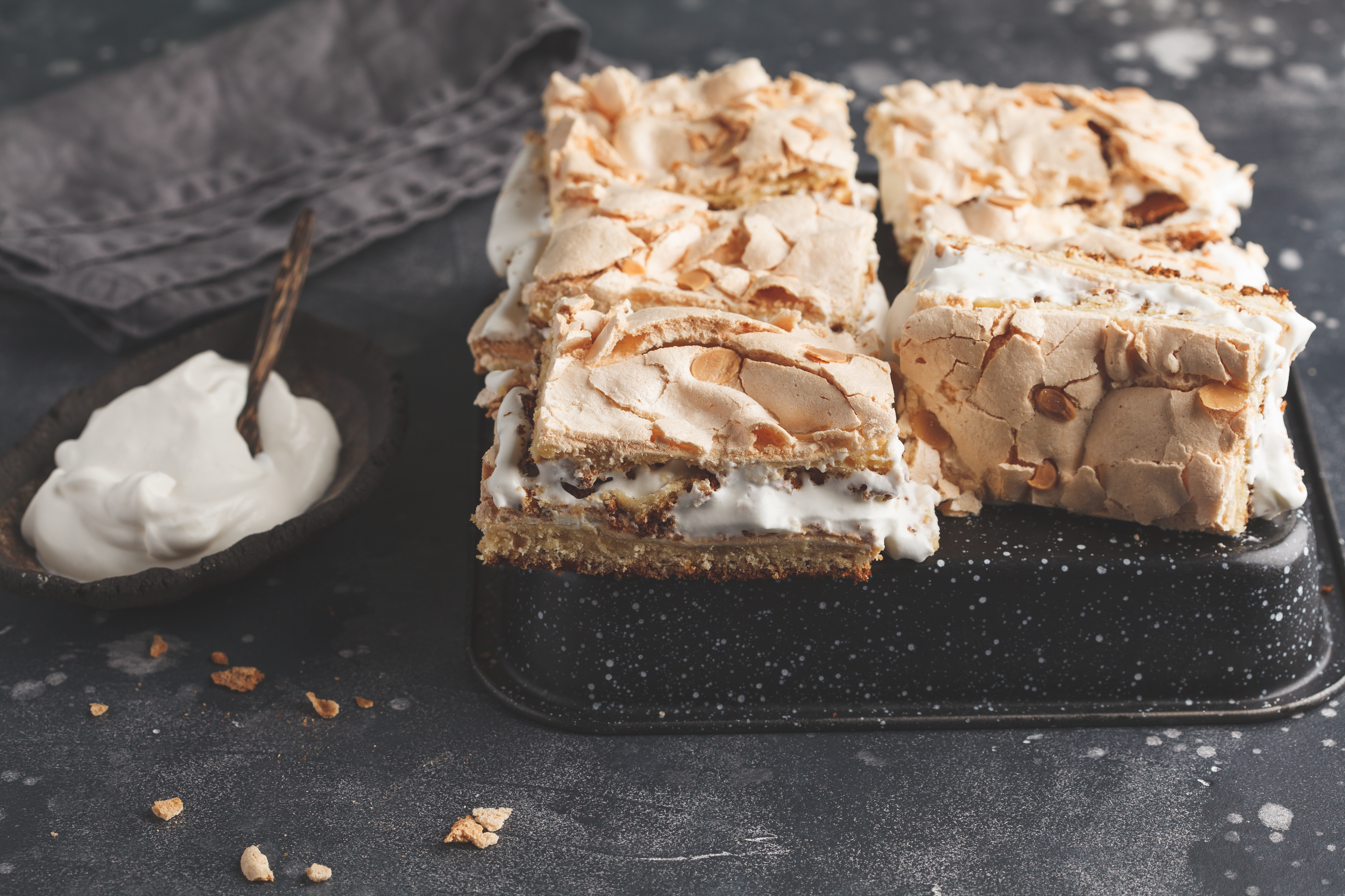 Norwegian,Cake,With,Meringue,And,Whipped,Cream,,Dark,Background