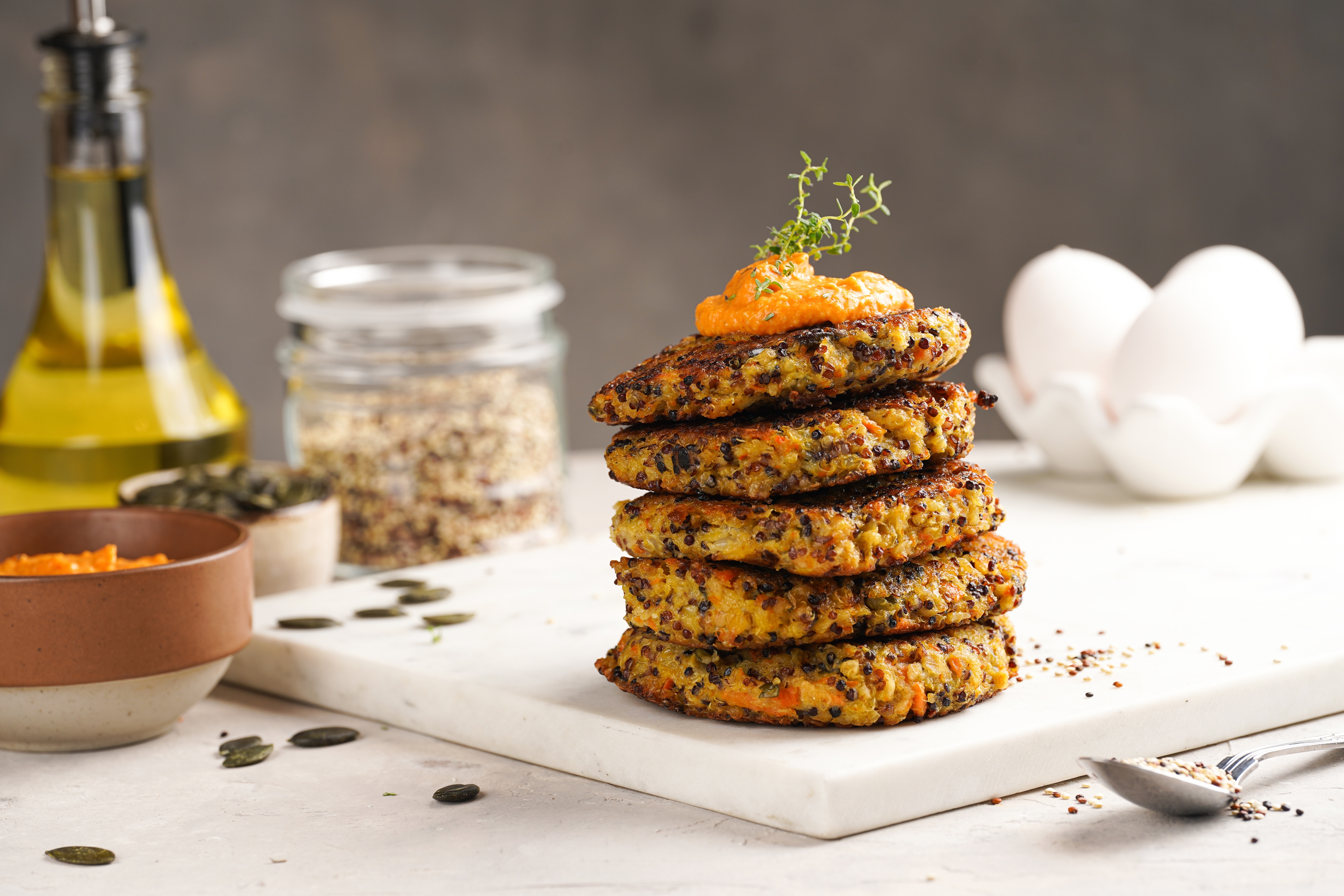 Vegetable,Carrot,And,Quinoa,Pancakes,In,Stack,Topped,With,Paprika