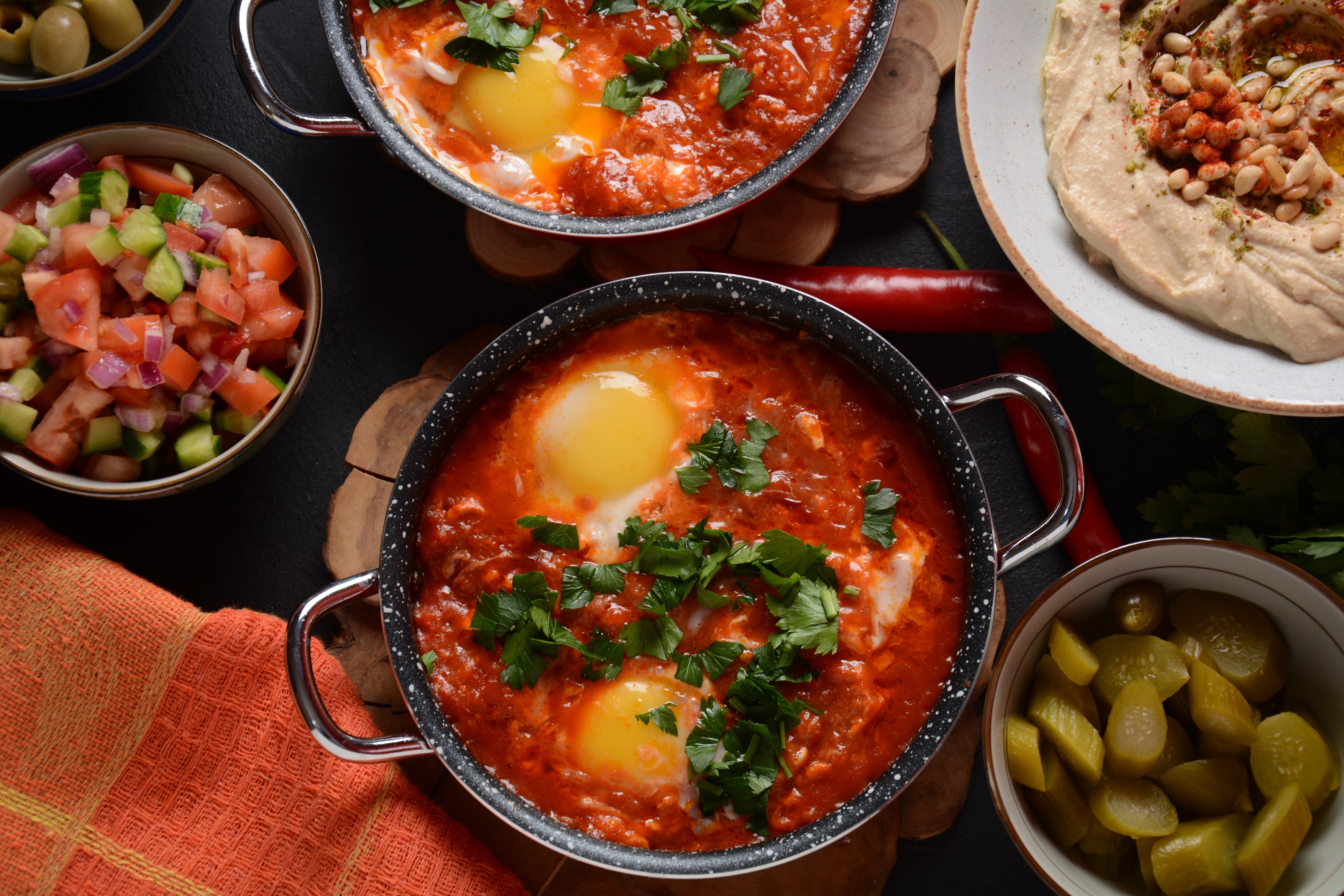 Shakshouka, eggs poached in sauce of tomatoes, olive oil, peppers, onion and garlic, Mediterranean cuisine