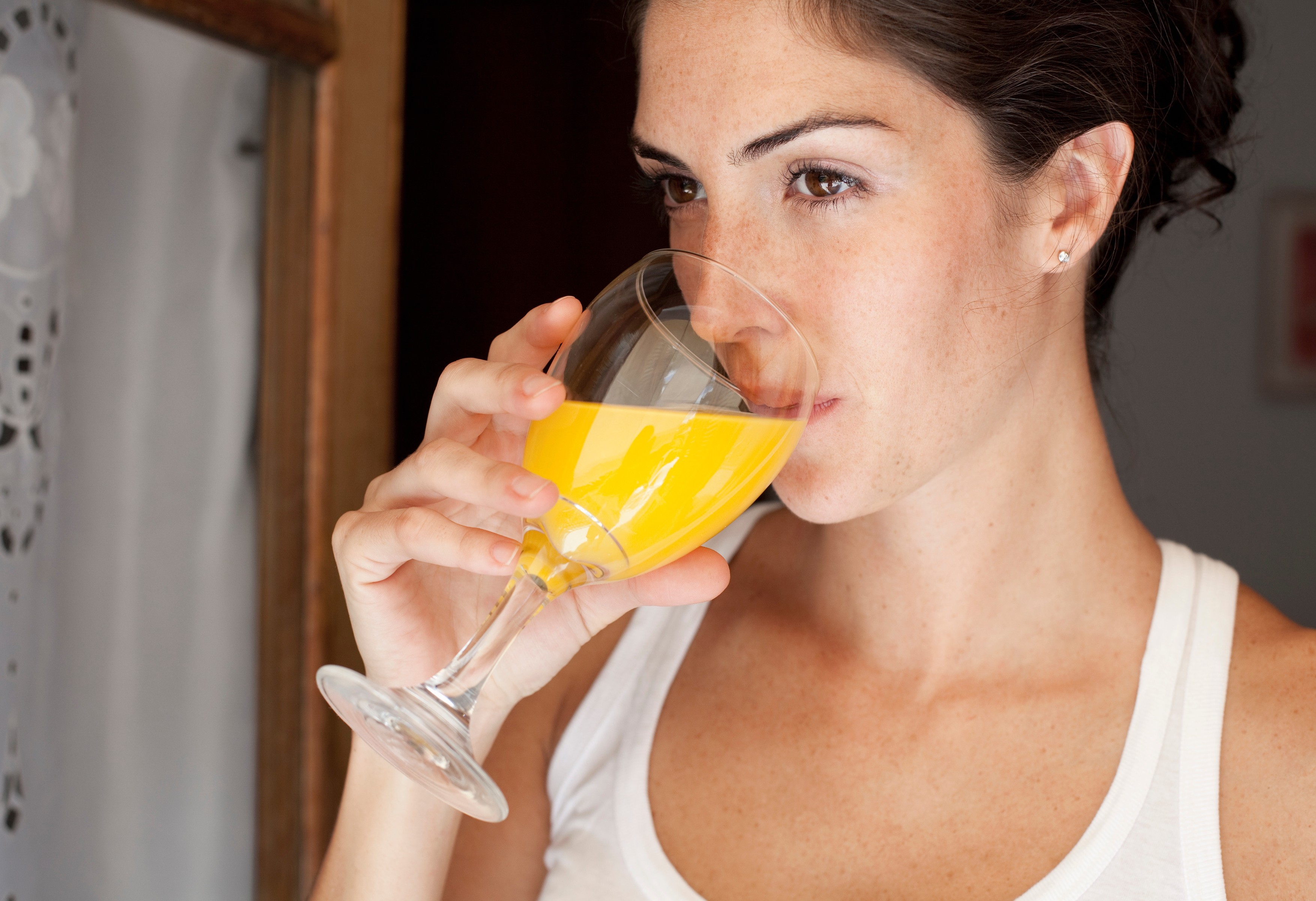 Woman drinking orange juice