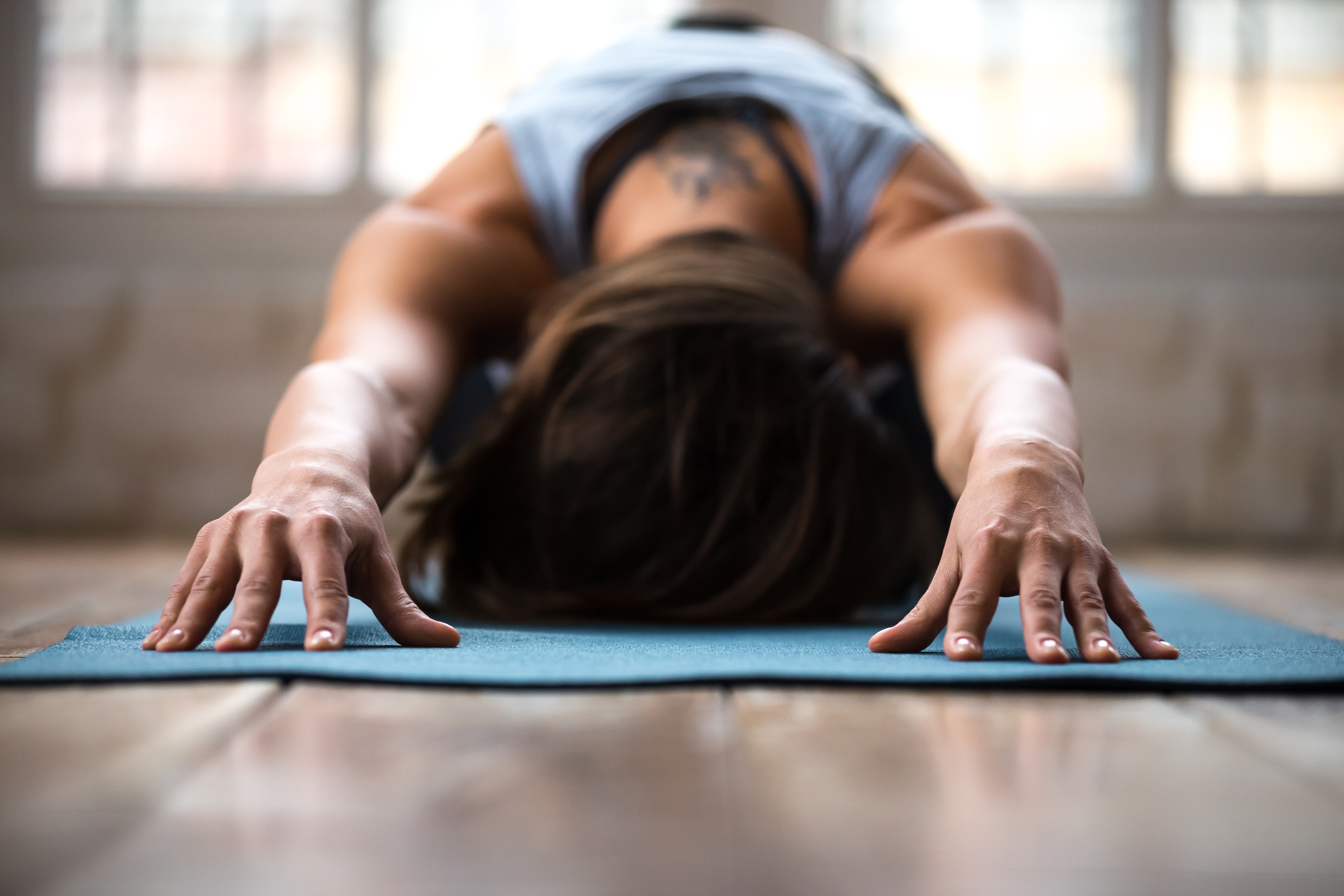 Young,Sporty,Attractive,Woman,Practicing,Yoga,,Doing,Child,Exercise,,Balasana