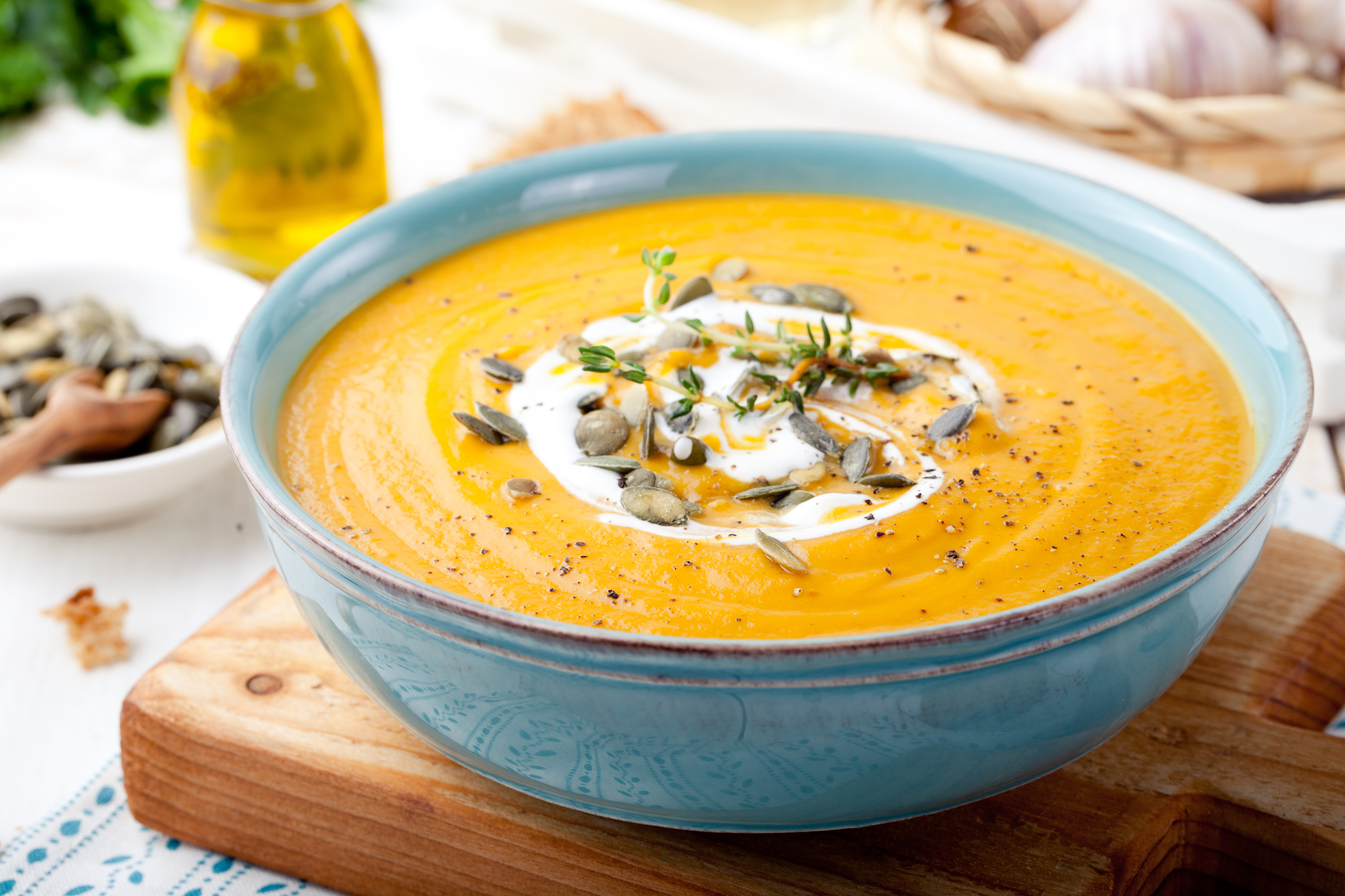 Roasted,Pumpkin,And,Carrot,Soup,With,Cream,And,Pumpkin,Seeds