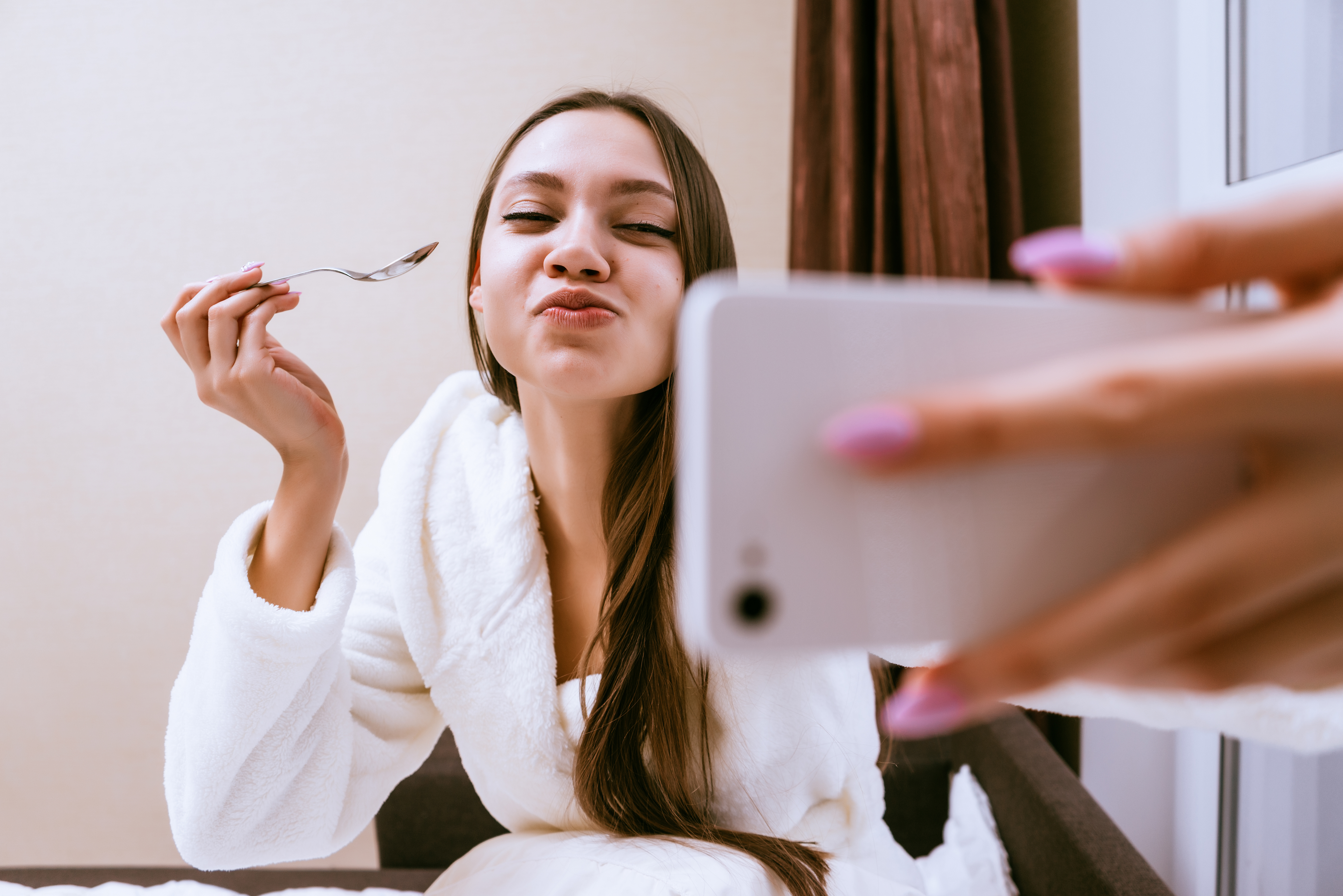 A,Girl,In,A,White,Coat,Makes,A,Selfie,At