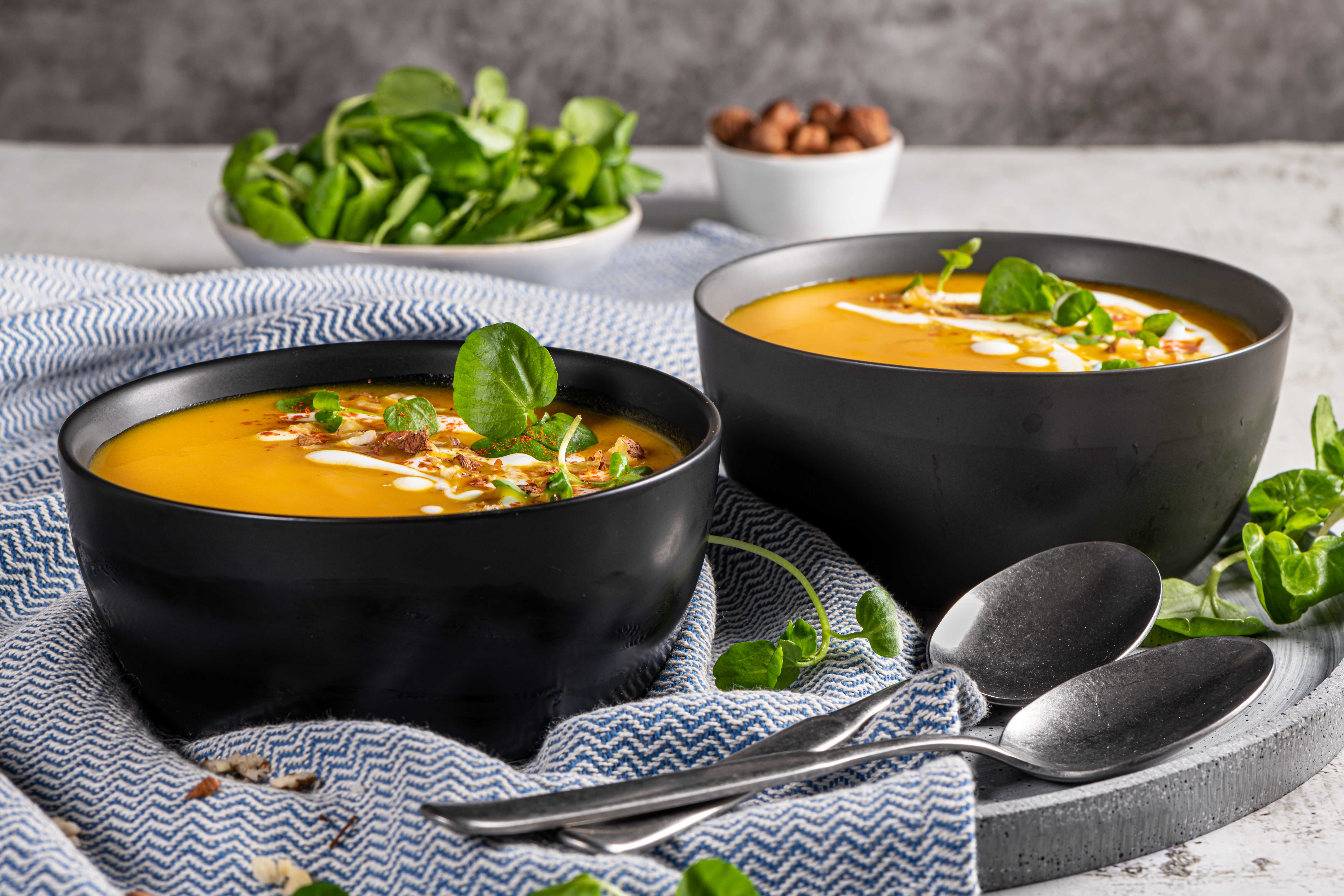Pumpkin,Soup,With,Watercress,On,Table.,Seasonal,Autumn,Food,-