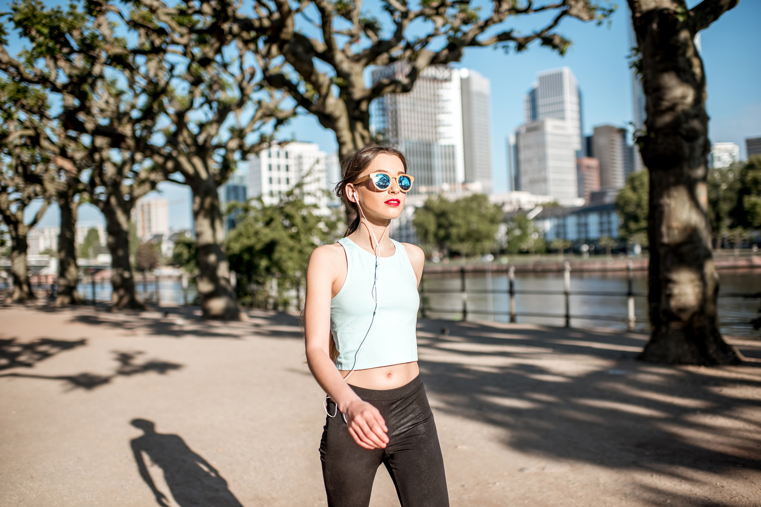 Young,Woman,In,Sportswear,Having,A,Morning,Exercise,Walking,In