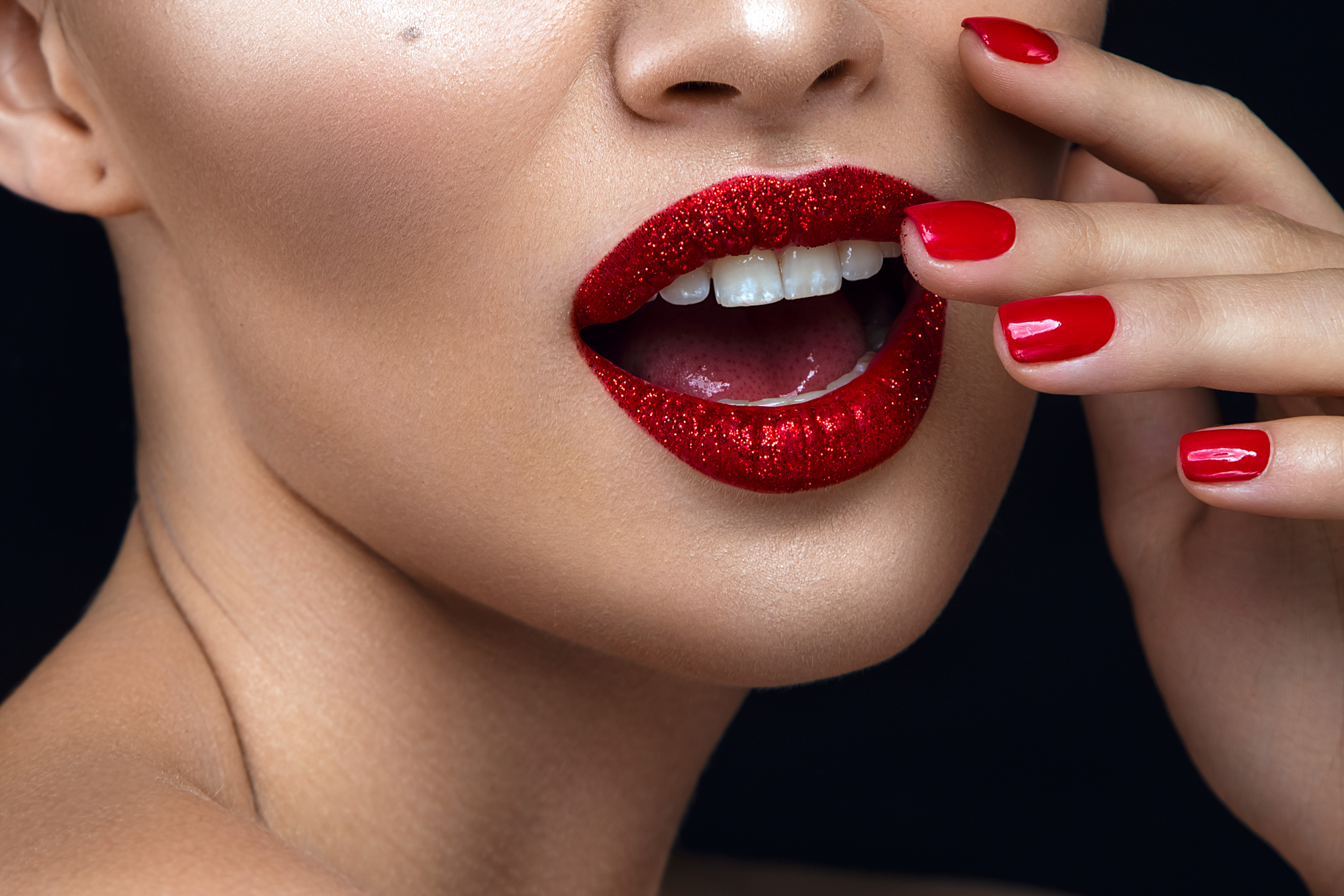 Fashion,Woman,Portrait,On,Black,Background,With,Red,Shiny,Lips.