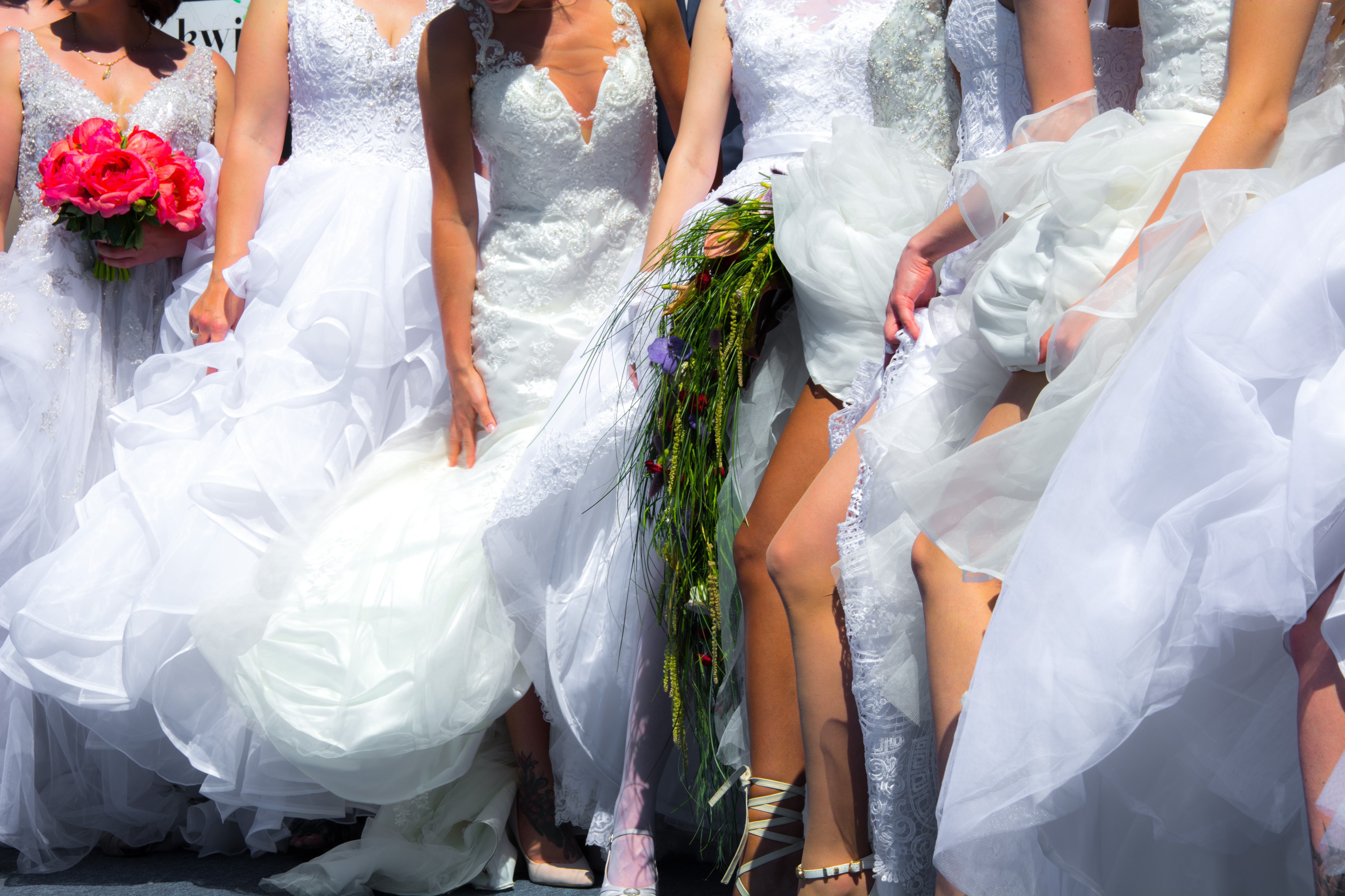 Wedding,Group,Of,Brides,Posing,With,A,Naked,Leg.
