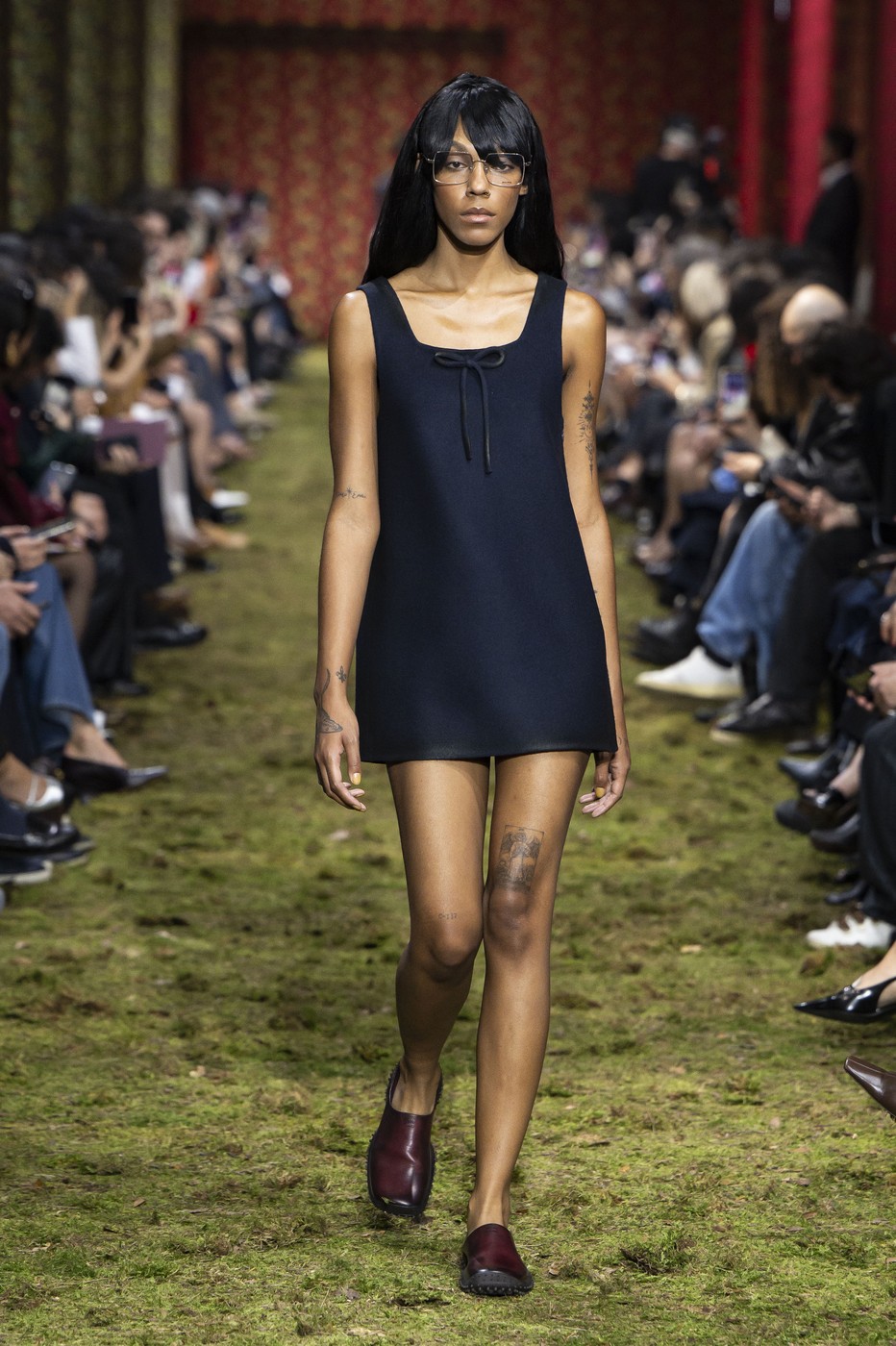 A model is seen on the catwalk at the Miu Miu