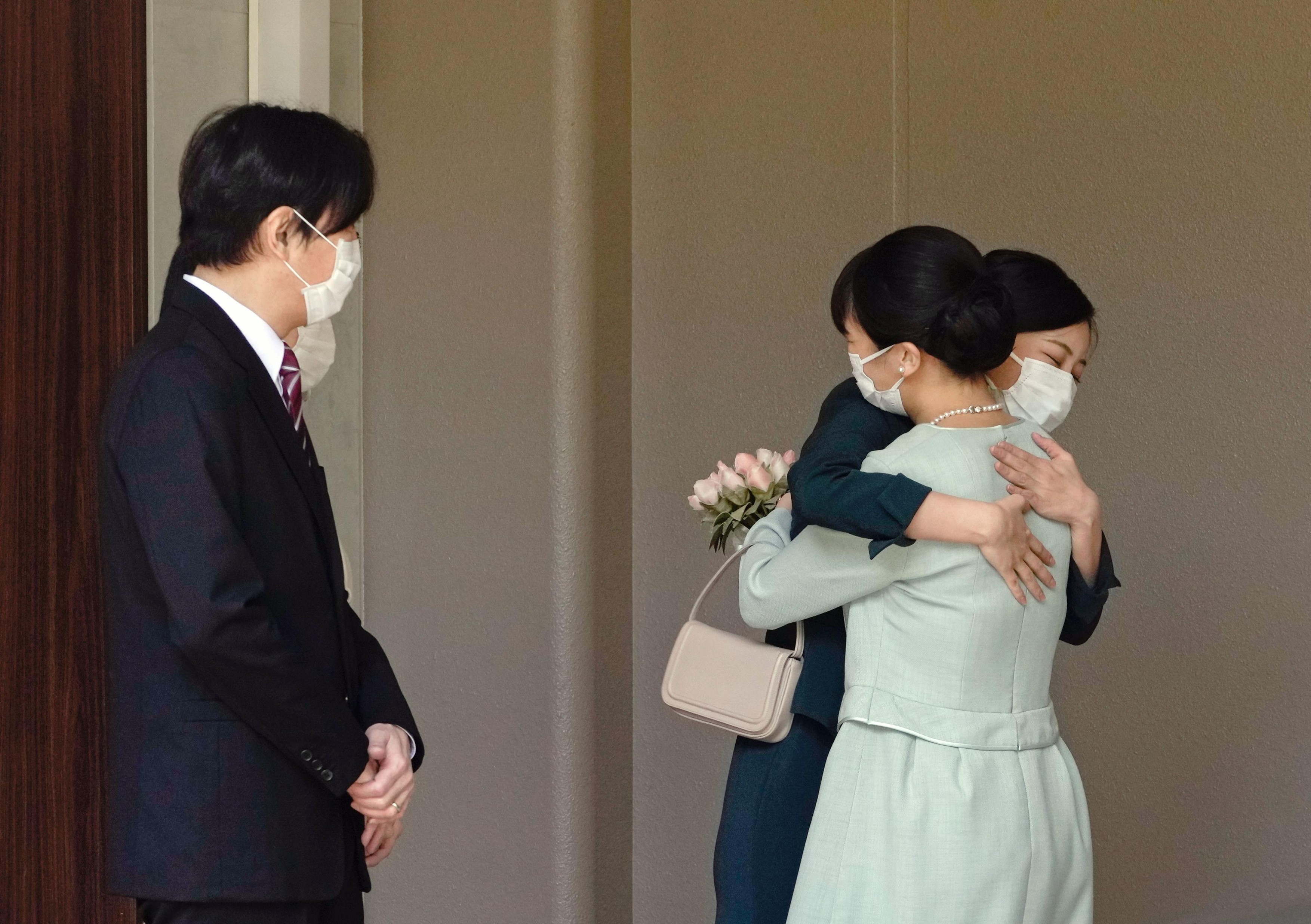 Japanese Princess Mako (R) is hugged by her younger sister Princess