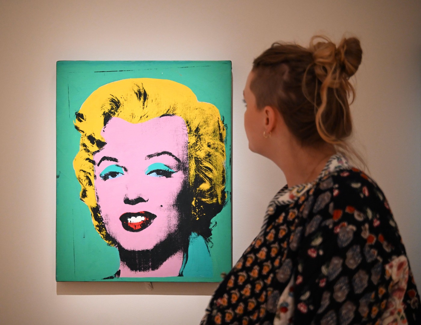 Bringing together works by Andy Woman behind the image