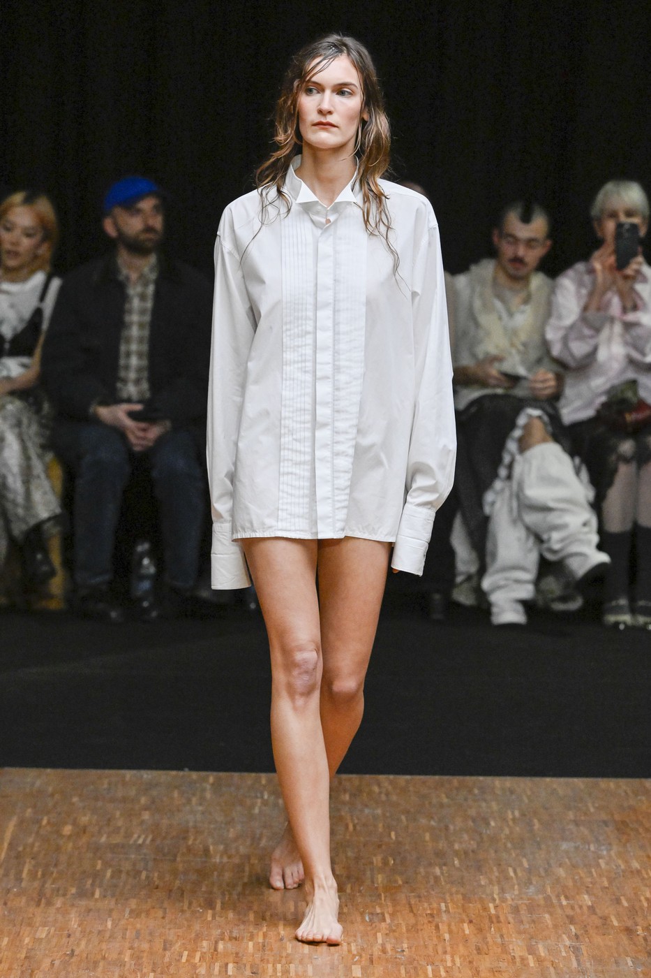 A model is seen on the catwalk at the Hodakova