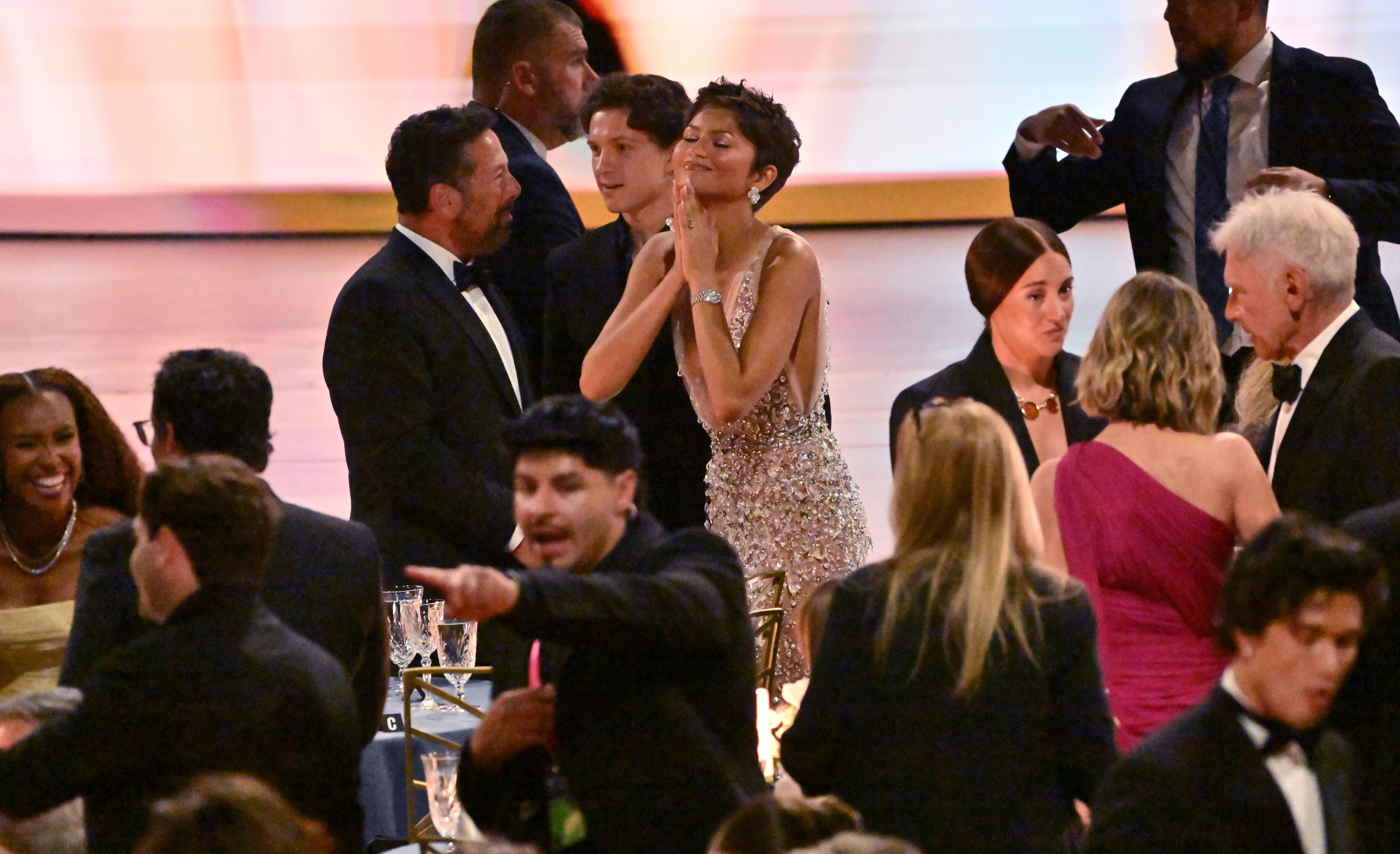 Tom Holland and Zendaya are seen in the audience