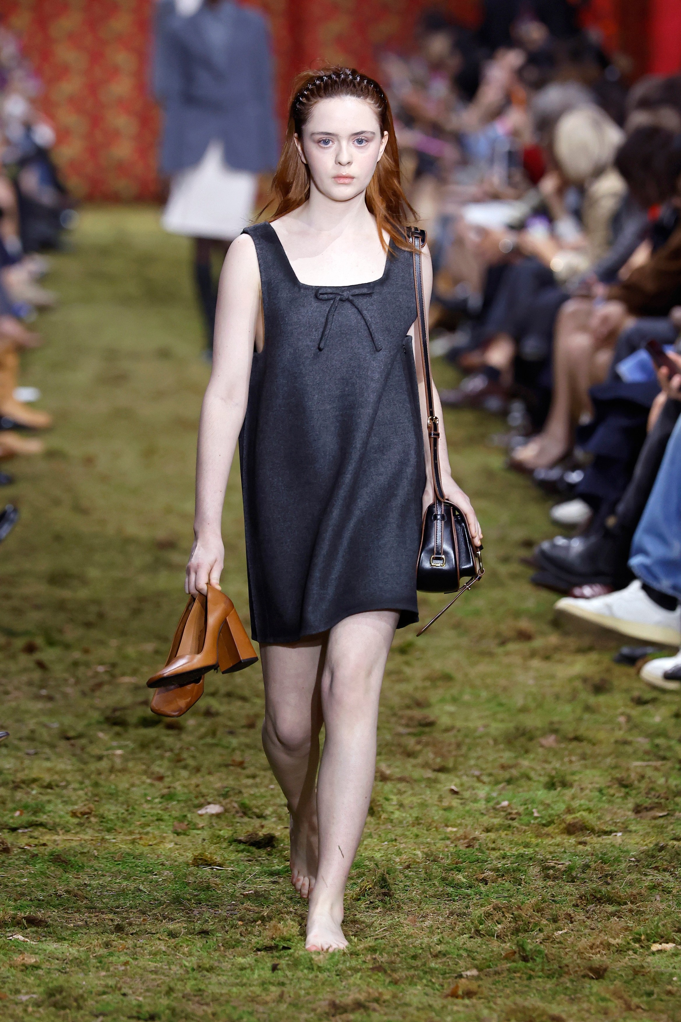 Model on the runway at the Miu Miu fashion show in Paris